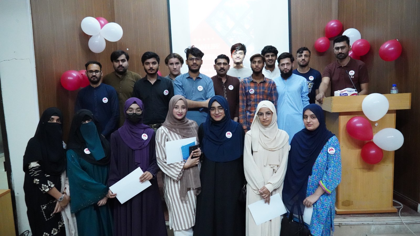 University students and SAM Life Savers volunteers posing for a group photo after a community service project and volunteer engagement session.